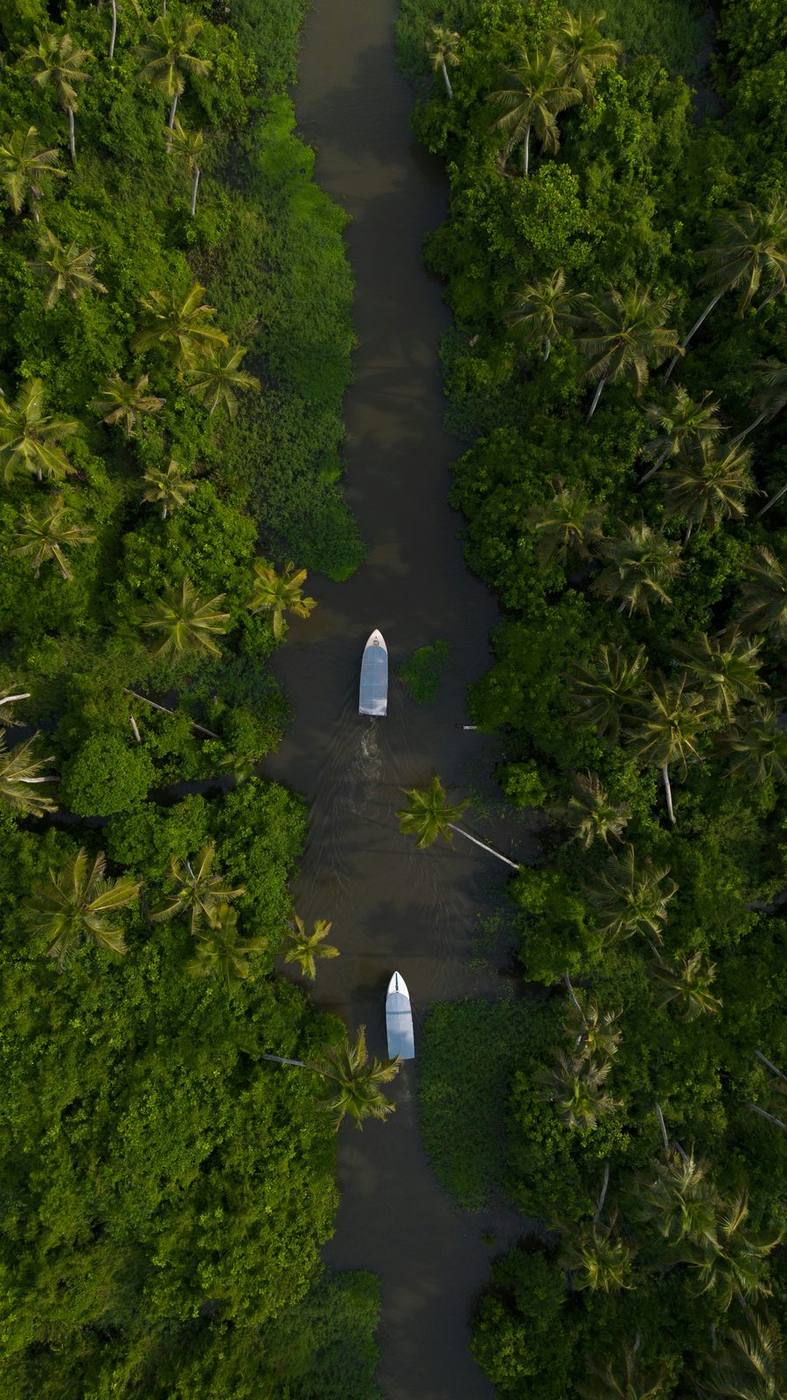 A canoe on a narrow Kerala backwater canal